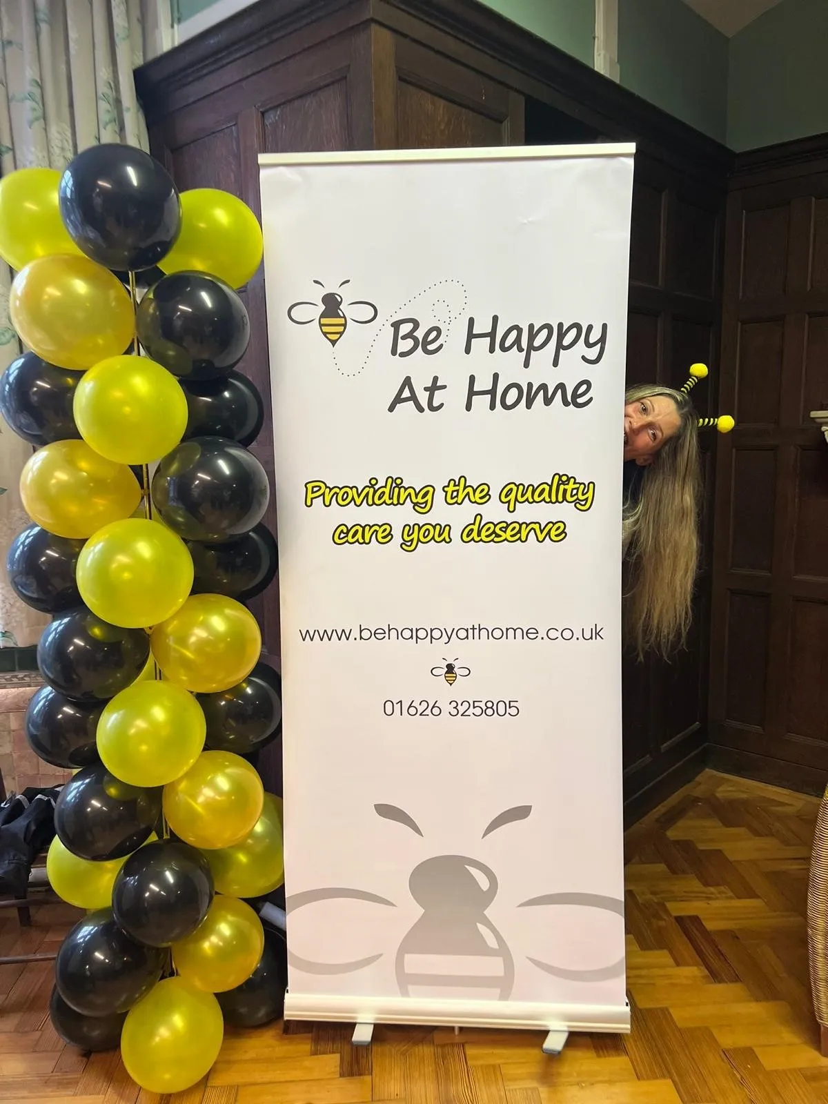 A sign that says be happy at home.