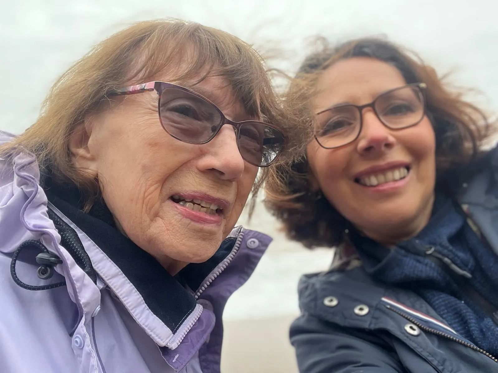 Two women taking a selfie on a beach.